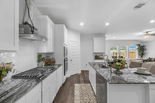 3913 Silver Fls, League City, TX 77573 - kitchen with stainless steel appliances, white cabinets, open floor plan, recessed lighting, and stone countertops