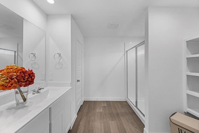 3913 Silver Fls, League City, TX 77573 - bathroom with wood finished floors, vanity, and a stall shower