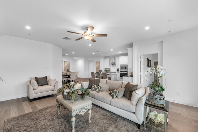 3913 Silver Fls, League City, TX 77573 - living room featuring light wood-style flooring, ceiling fan, and recessed lighting