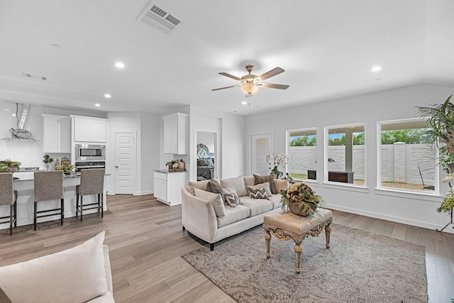 3913 Silver Fls, League City, TX 77573 - living room with recessed lighting, a ceiling fan, and light wood-style floors