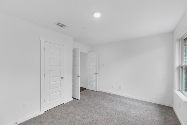 3913 Silver Fls, League City, TX 77573 - unfurnished bedroom with carpet floors and multiple windows