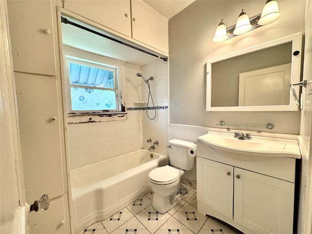 2616 Beauchamp St, Houston, TX 77009 - full bath featuring shower / bathtub combination, vanity, tile patterned flooring, and wainscoting