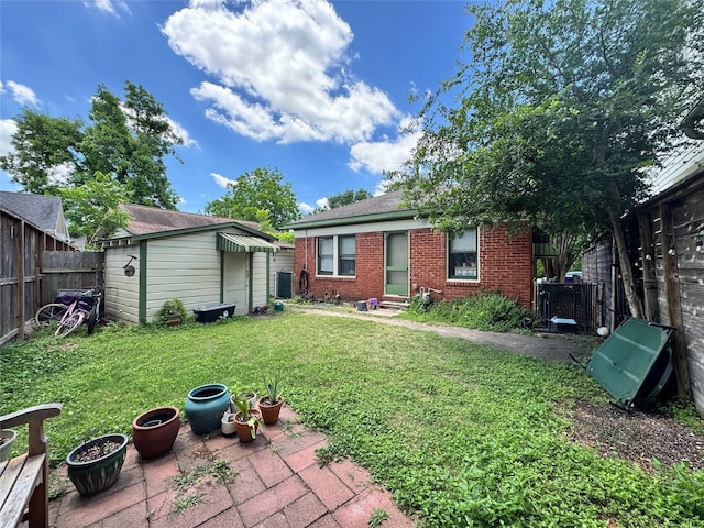 2616 Beauchamp St, Houston, TX 77009 - back of property featuring brick siding, entry steps, a fenced backyard, and a patio