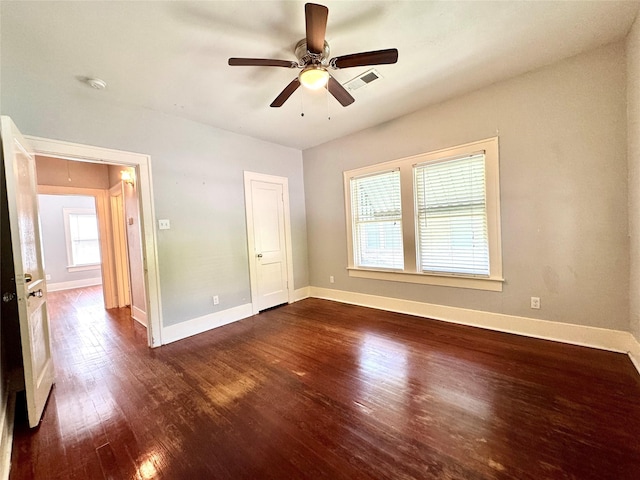 2616 Beauchamp St, Houston, TX 77009 - unfurnished bedroom with dark wood-style floors and a ceiling fan