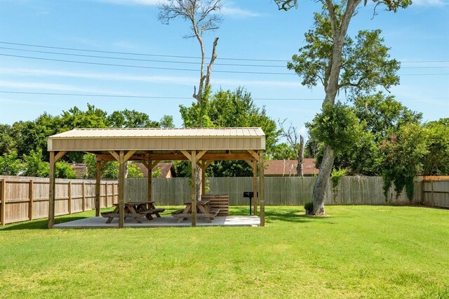 511 Moore St, Richwood, TX 77531 - fenced backyard featuring a gazebo and a patio area