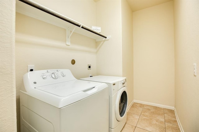 511 Moore St, Richwood, TX 77531 - laundry room with washing machine and dryer and light tile patterned flooring