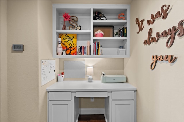 1509 Preserve Ln, Pearland, TX 77089 - home office with built in desk and dark wood-style floors