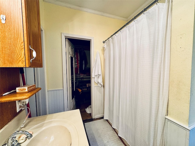 2614 Beauchamp St, Houston, TX 77009 - bathroom with crown molding, a wainscoted wall, vanity, and curtained shower