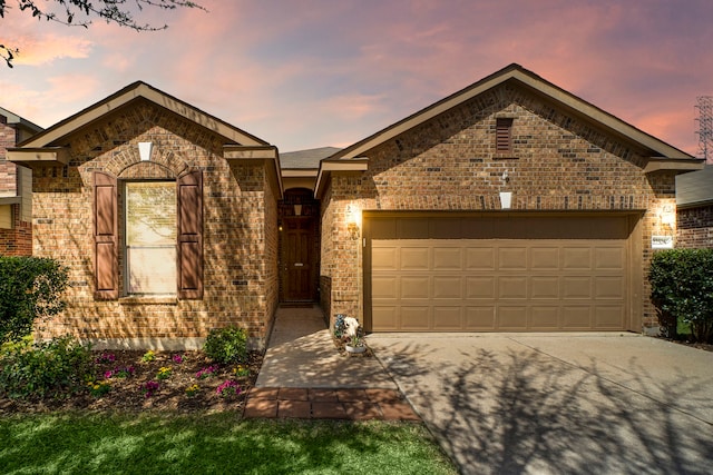 22526 Belmont Cove Ln, Katy, TX 77449 - view of front of home featuring concrete driveway, a garage, and brick siding