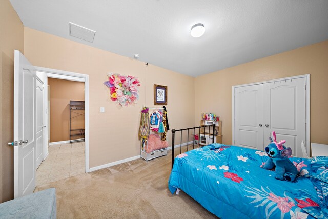 22526 Belmont Cove Ln, Katy, TX 77449 - bedroom featuring light colored carpet and a closet