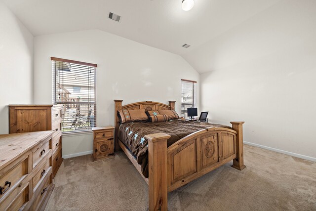 22526 Belmont Cove Ln, Katy, TX 77449 - bedroom featuring vaulted ceiling, light carpet, and multiple windows