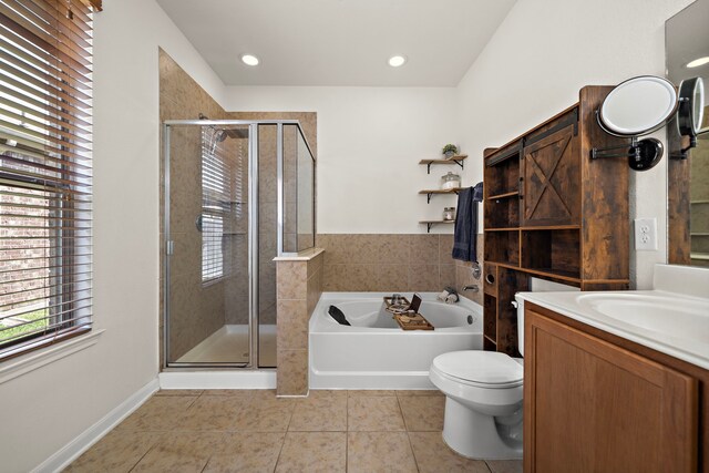 22526 Belmont Cove Ln, Katy, TX 77449 - full bath with tile patterned flooring, a garden tub, a stall shower, vanity, and recessed lighting