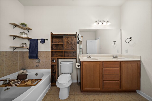 22526 Belmont Cove Ln, Katy, TX 77449 - bathroom with a bath, double vanity, and tile patterned floors