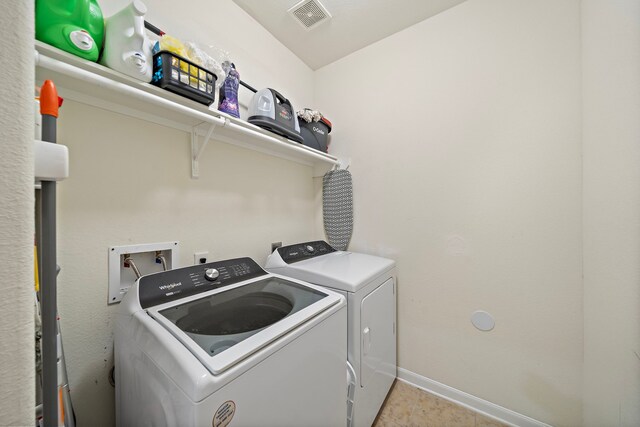 22526 Belmont Cove Ln, Katy, TX 77449 - laundry room with separate washer and dryer and baseboards