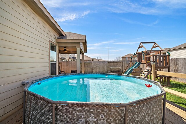 22526 Belmont Cove Ln, Katy, TX 77449 - view of pool with a fenced backyard, a playground, and ceiling fan