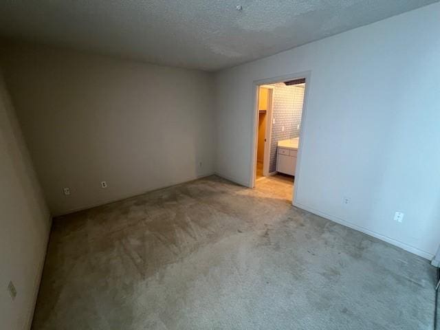 7655 S Braeswood Blvd Unit 8, Houston, TX 77071 - empty room with light carpet and a textured ceiling