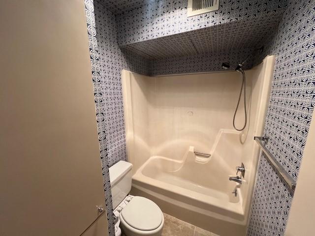 7655 S Braeswood Blvd Unit 8, Houston, TX 77071 - bathroom featuring bathtub / shower combination and tile patterned flooring