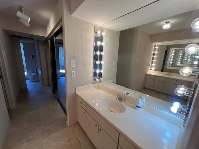 7655 S Braeswood Blvd Unit 8, Houston, TX 77071 - bathroom featuring vanity and tile patterned floors