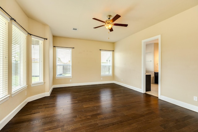 10306 Terra St, Iowa Colony, TX 77583 - empty room with dark wood finished floors and a ceiling fan