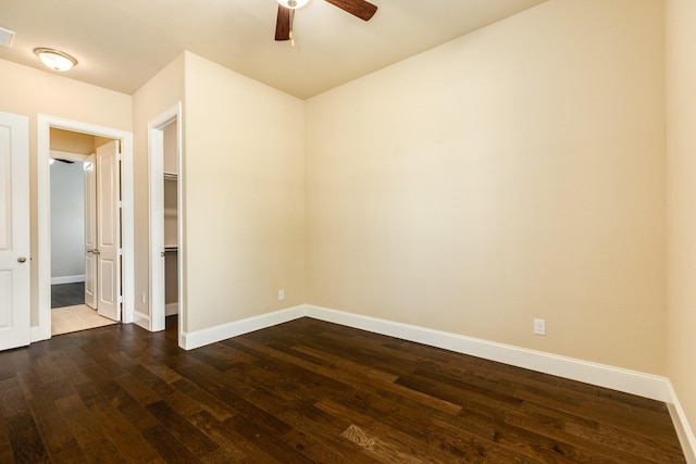 10306 Terra St, Iowa Colony, TX 77583 - unfurnished bedroom featuring dark wood-type flooring and ceiling fan