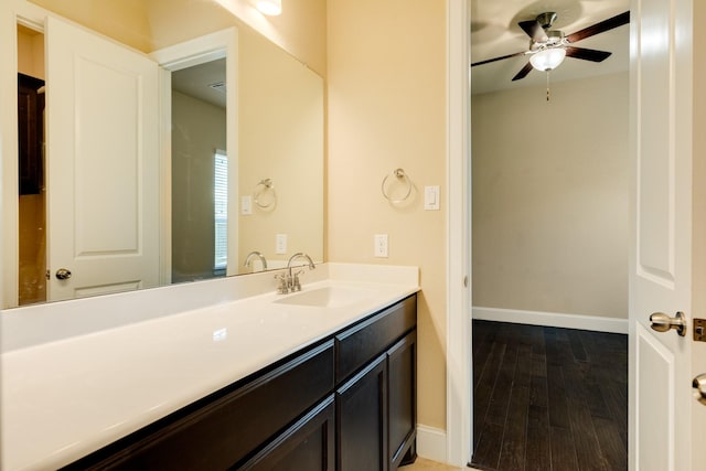 10306 Terra St, Iowa Colony, TX 77583 - bathroom featuring wood finished floors, vanity, and a ceiling fan