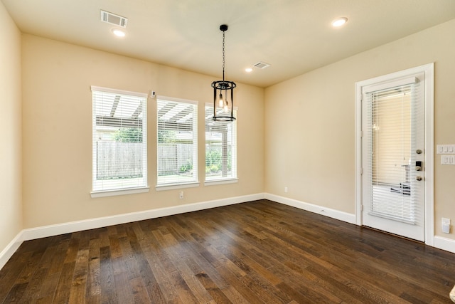 10306 Terra St, Iowa Colony, TX 77583 - unfurnished dining area featuring dark wood-type flooring and recessed lighting
