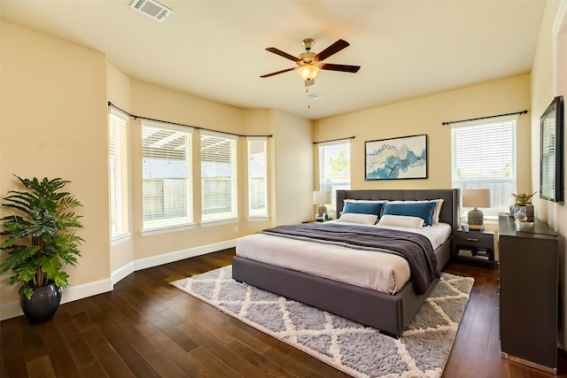 10306 Terra St, Iowa Colony, TX 77583 - bedroom featuring dark wood-style floors and a ceiling fan