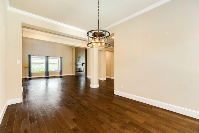 10306 Terra St, Iowa Colony, TX 77583 - unfurnished room with a chandelier, ornamental molding, and dark wood finished floors