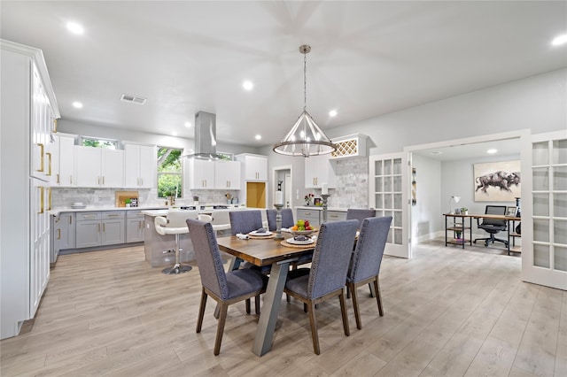 459 Live Oak Rd, Wharton, TX 77488 - dining room with light wood-type flooring, a chandelier, recessed lighting, an office area, and french doors
