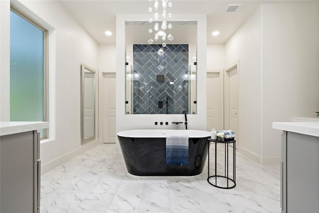 459 Live Oak Rd, Wharton, TX 77488 - bathroom with marble finish floors, vanity, a soaking tub, and recessed lighting
