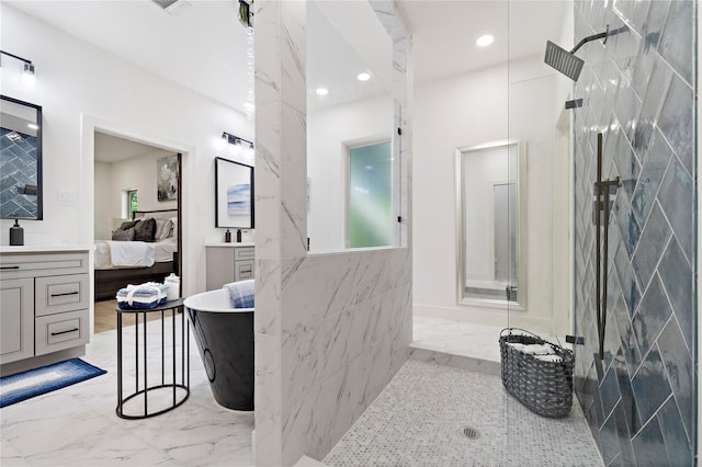 459 Live Oak Rd, Wharton, TX 77488 - bathroom with marble tiled flooring, vanity, ensuite bath, a freestanding tub, and recessed lighting