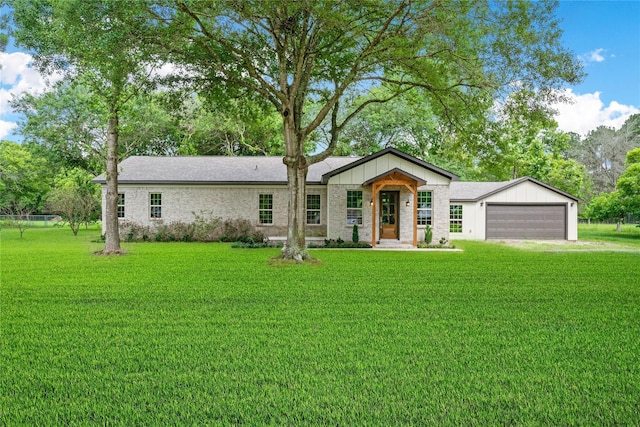 459 Live Oak Rd, Wharton, TX 77488 - view of front of property with a front yard and a garage