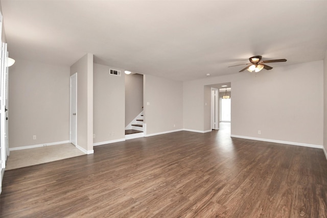 6307 Briar Rose Dr Unit 120, Houston, TX 77057 - empty room featuring a ceiling fan, stairway, and dark wood-type flooring