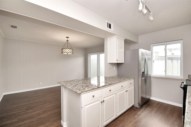 6307 Briar Rose Dr Unit 120, Houston, TX 77057 - kitchen with dark wood-style floors, white cabinets, a peninsula, stove, and stainless steel refrigerator with ice dispenser
