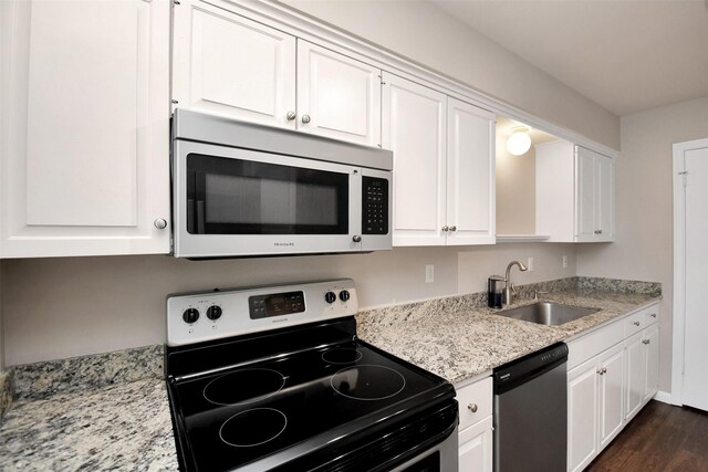6307 Briar Rose Dr Unit 120, Houston, TX 77057 - kitchen featuring stainless steel appliances, white cabinets, and dark wood-type flooring
