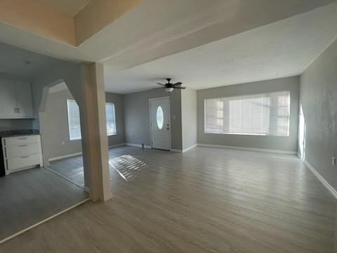 1114 E Pecan St, Angleton, TX 77515 - unfurnished living room with wood finished floors and a ceiling fan