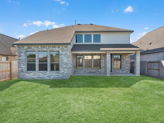 10806 Capella Creek Way, Richmond, TX 77406 - back of property with a patio, a fenced backyard, brick siding, and roof with shingles