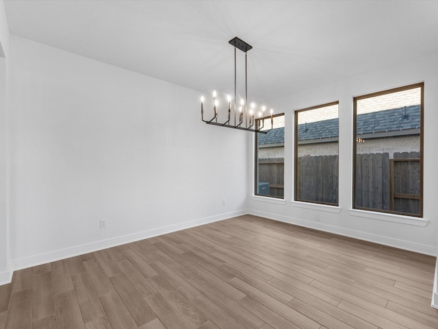 10806 Capella Creek Way, Richmond, TX 77406 - unfurnished room with a chandelier and wood finished floors