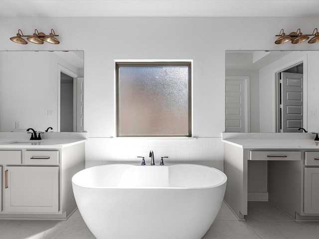 10806 Capella Creek Way, Richmond, TX 77406 - full bath featuring two vanities, marble finish flooring, and a freestanding bath