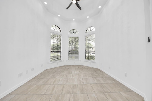 16015 Conners Ace Dr, Spring, TX 77379 - tiled empty room with ceiling fan and recessed lighting