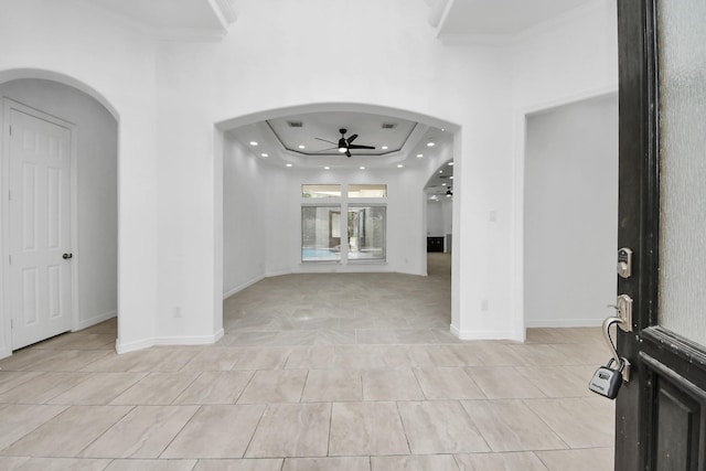 16015 Conners Ace Dr, Spring, TX 77379 - foyer entrance featuring ceiling fan, arched walkways, light tile patterned flooring, crown molding, and a raised ceiling