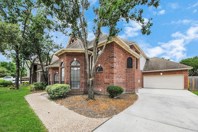 16015 Conners Ace Dr, Spring, TX 77379 - view of front of property with a garage, concrete driveway, brick siding, and a front yard