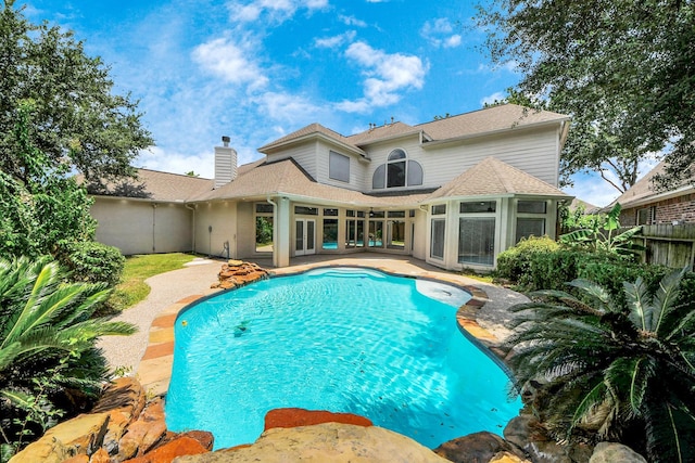 16015 Conners Ace Dr, Spring, TX 77379 - view of pool featuring french doors, a patio, and a sunroom