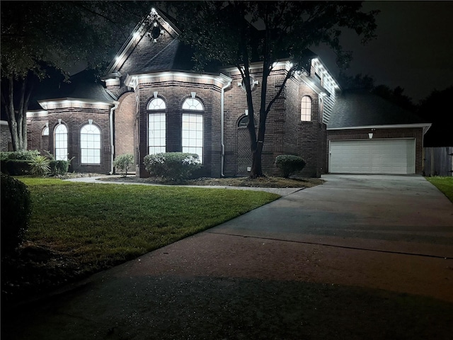 16015 Conners Ace Dr, Spring, TX 77379 - french provincial home featuring brick siding, a garage, a lawn, and driveway