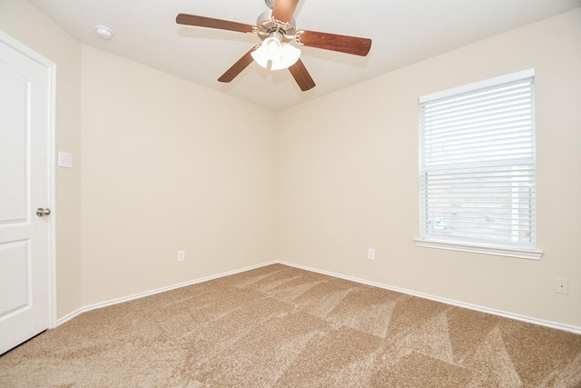 19826 Seagler Glen Ln, Katy, TX 77449 - empty room with light carpet, a ceiling fan, plenty of natural light, and a smoke detector