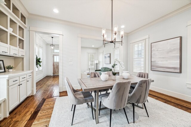 1017 Waverly St Unit B, Houston, TX 77008 - dining space featuring ornamental molding, wood finished floors, a chandelier, and recessed lighting
