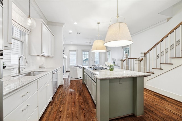 1017 Waverly St Unit B, Houston, TX 77008 - kitchen featuring stainless steel appliances, crown molding, a kitchen island, recessed lighting, and dark wood finished floors