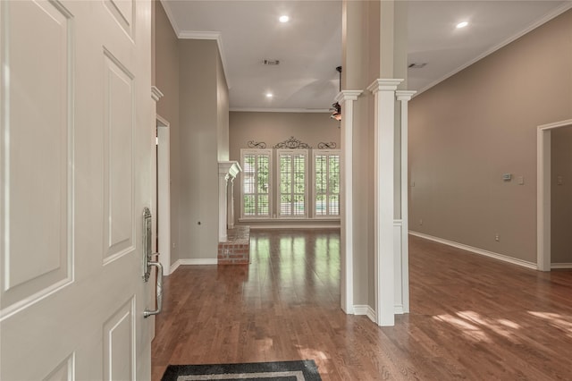 426 County Road 222, Nacogdoches, TX 75965 - hallway featuring ornate columns, ornamental molding, wood finished floors, and recessed lighting