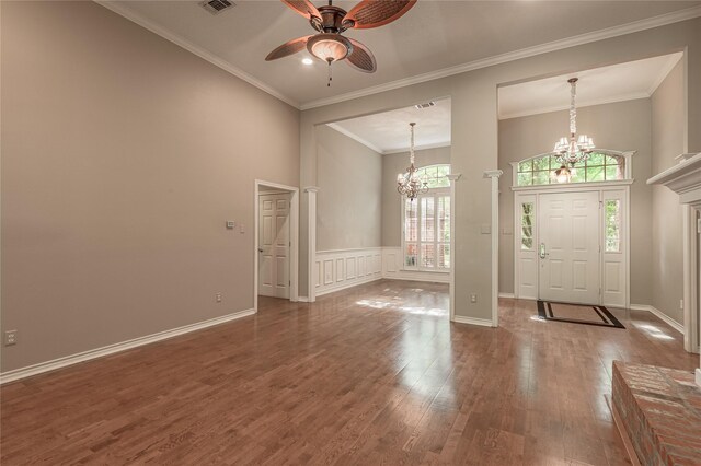 426 County Road 222, Nacogdoches, TX 75965 - foyer entrance with a chandelier, a ceiling fan, a towering ceiling, wood finished floors, and ornamental molding