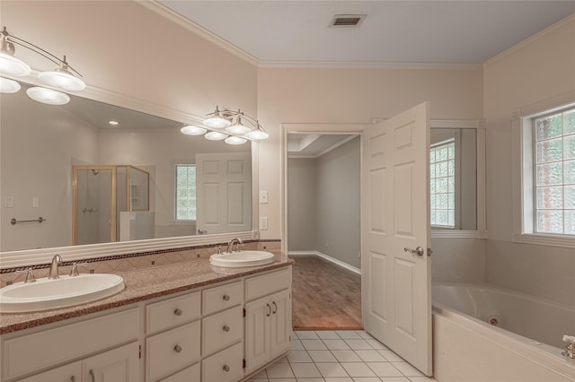 426 County Road 222, Nacogdoches, TX 75965 - full bath featuring a stall shower, a tub with jets, double vanity, tile patterned floors, and ornamental molding